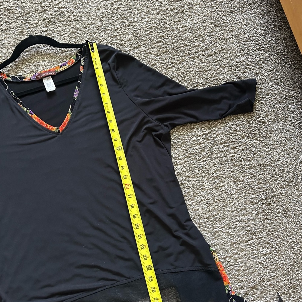 Black top with floral trim. - Picture 6 of 9